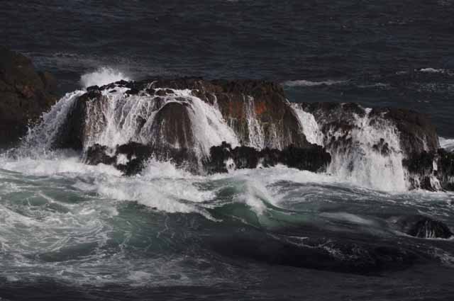 ocean waves over rock